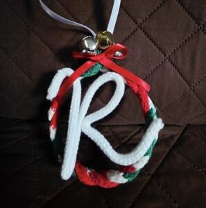 Festive Ornament with Bells and Ribbon